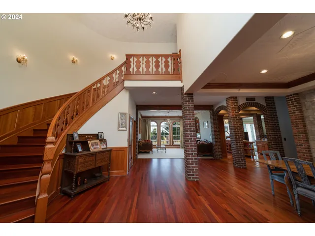 a view of a dining room with furniture and chandelier