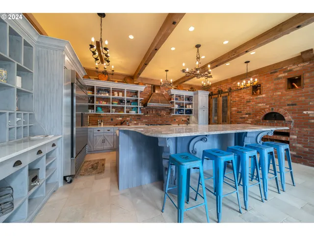 a kitchen with stainless steel appliances granite countertop a sink and stove
