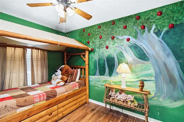 a bed room with furniture and a small yard