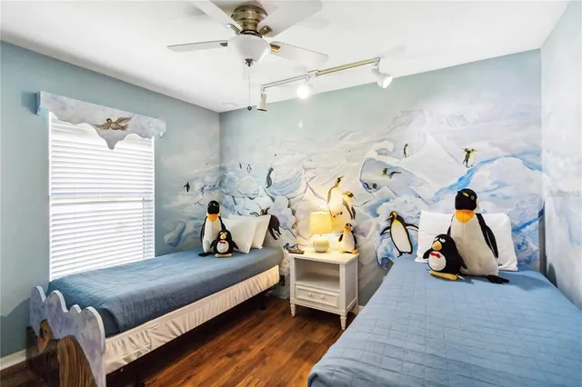 a bed room with furniture and gym equipment