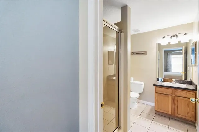 a bathroom with a toilet sink and a mirror