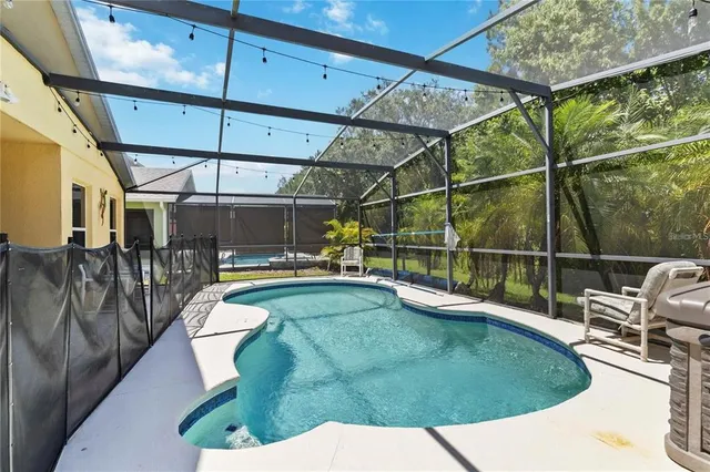 a view of a swimming pool with a patio