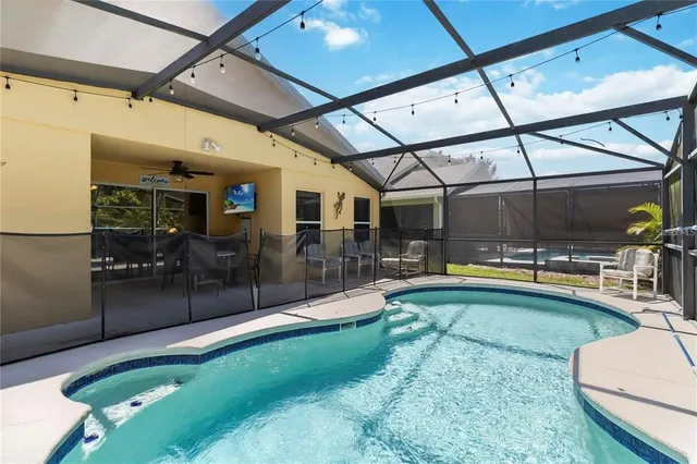 a view of a swimming pool with a patio
