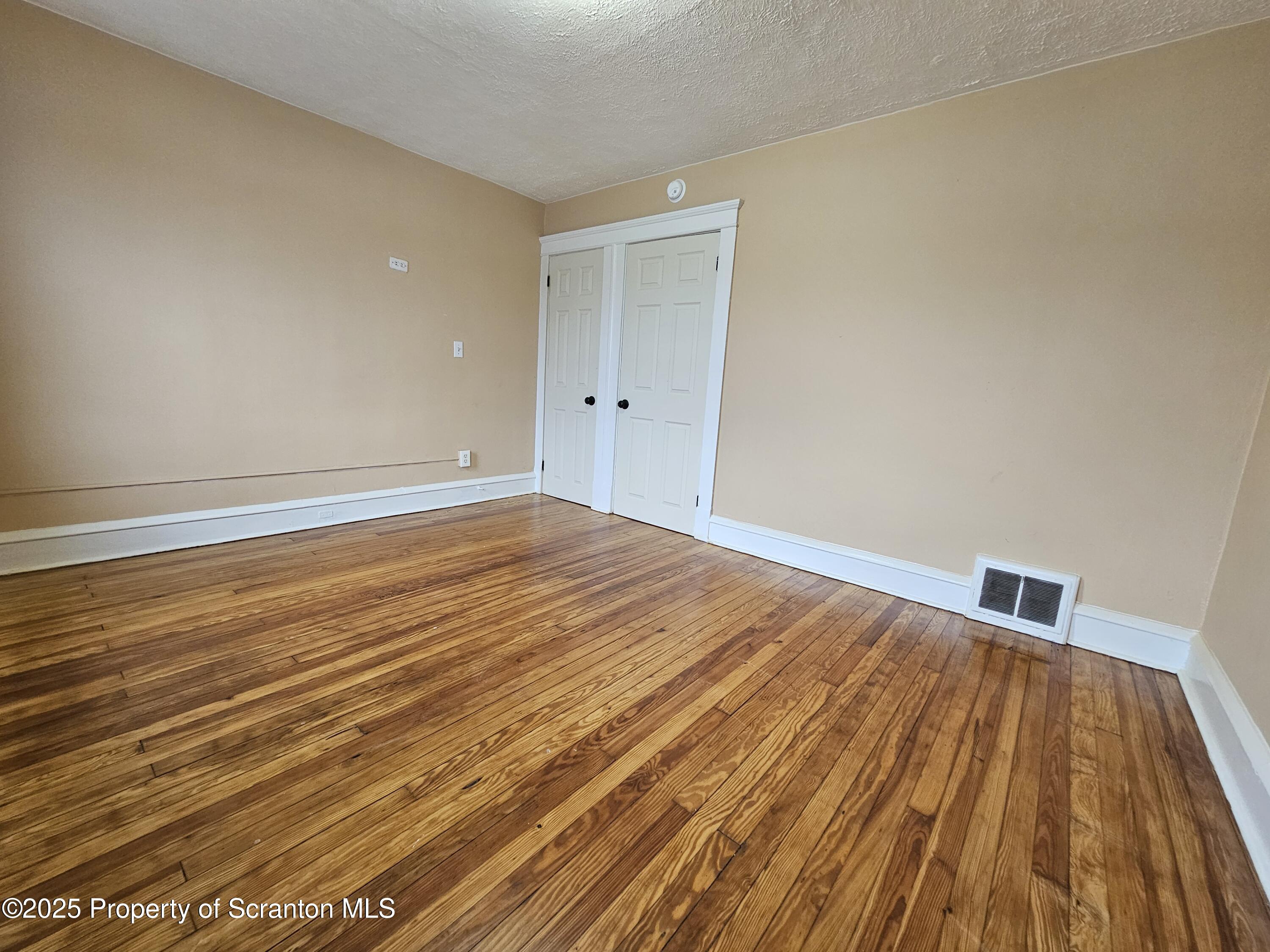775 Bennett Street Luzerne, PA 18709 - Photo 15 of 18 a view of empty room with wooden floor