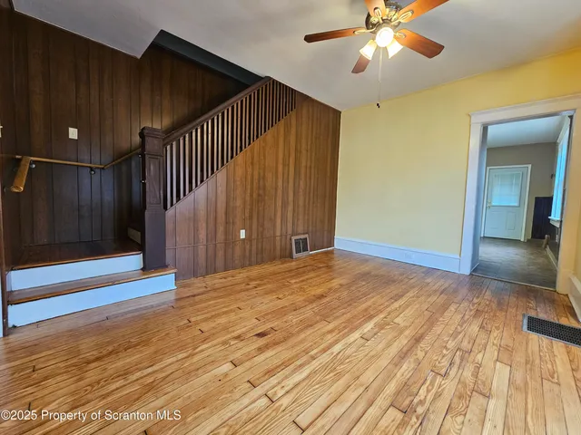 a view of a livingroom with wooden floor