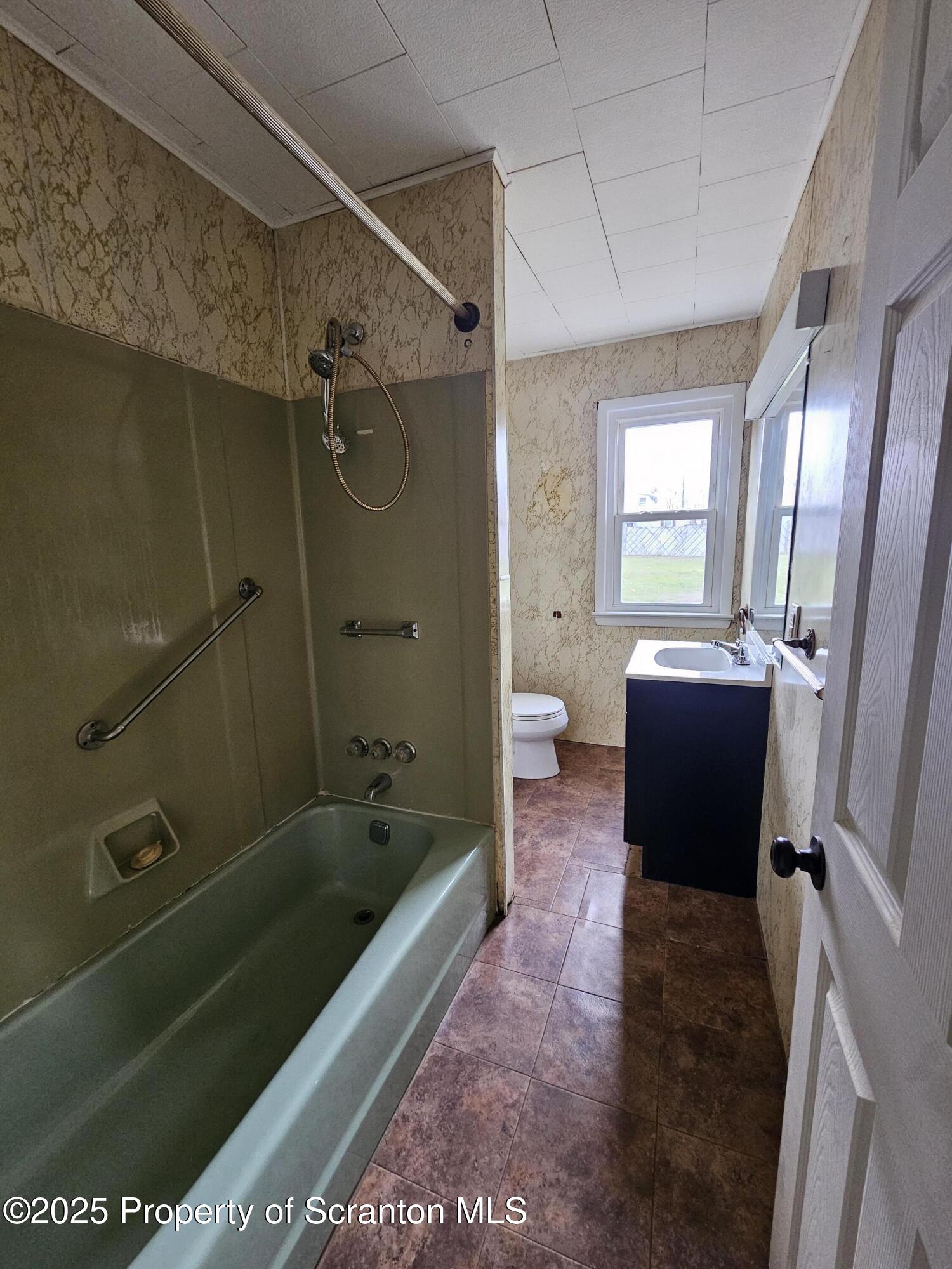 775 Bennett Street Luzerne, PA 18709 - Photo 7 of 18 a bathroom with a sink a toilet and shower