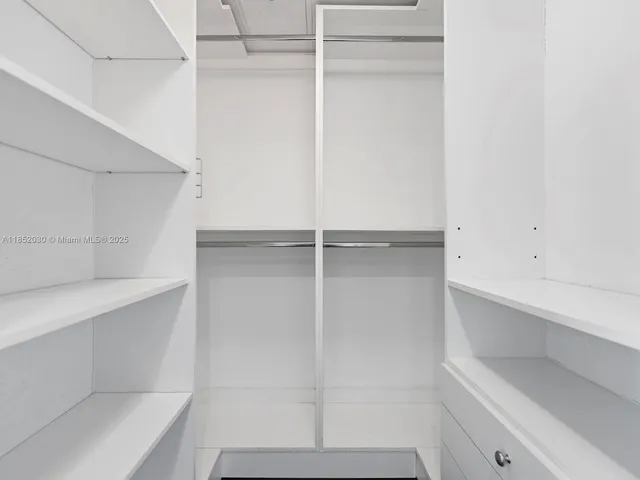 a view of an empty walk in closet