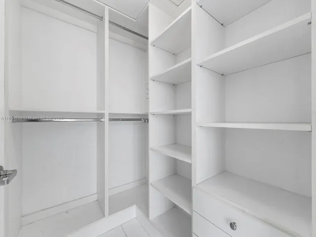 a view of an empty walk in closet