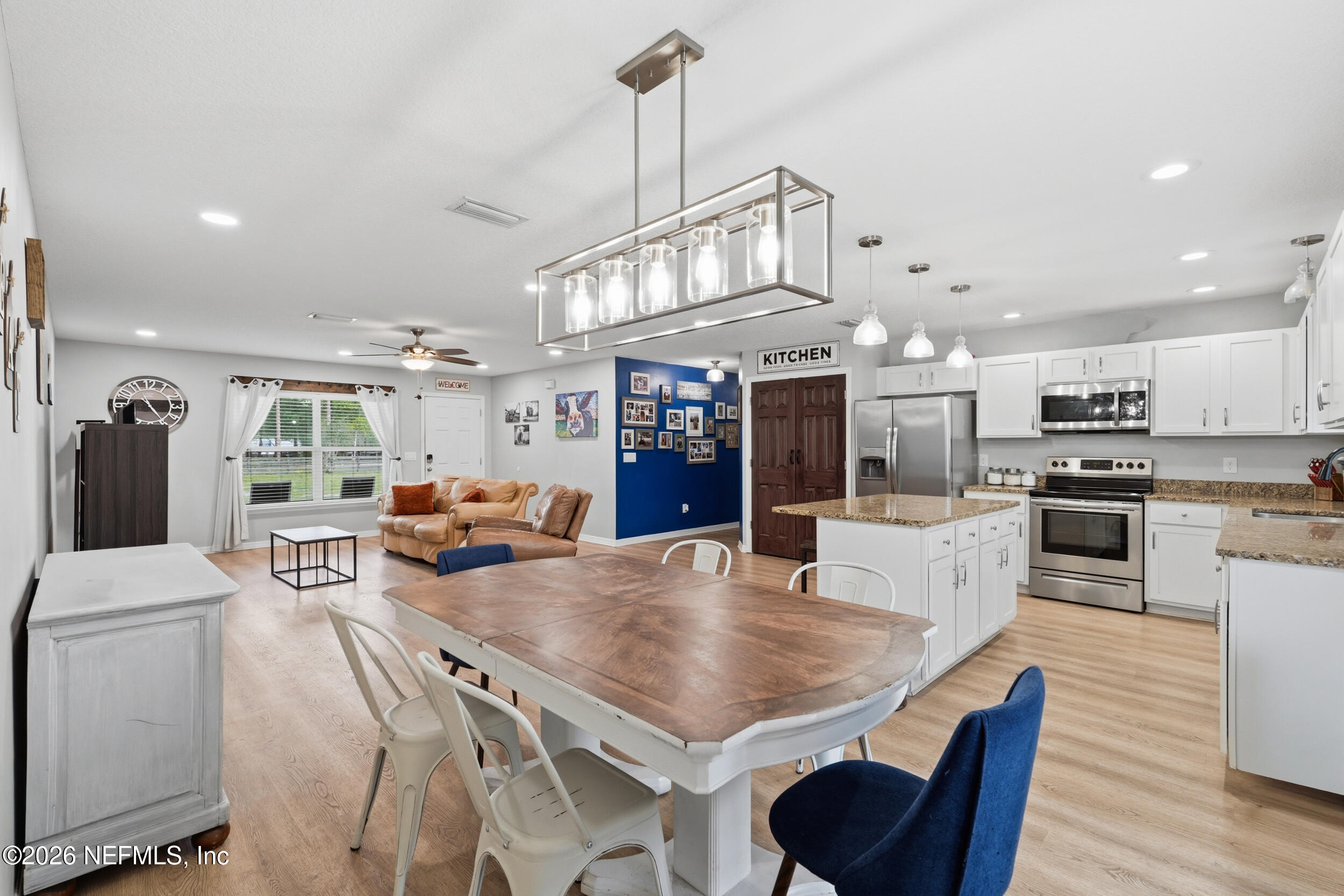 2471 Iris Street Middleburg, FL 32068 - Photo 12 of 40 a living room with stainless steel appliances furniture a dining table and chairs