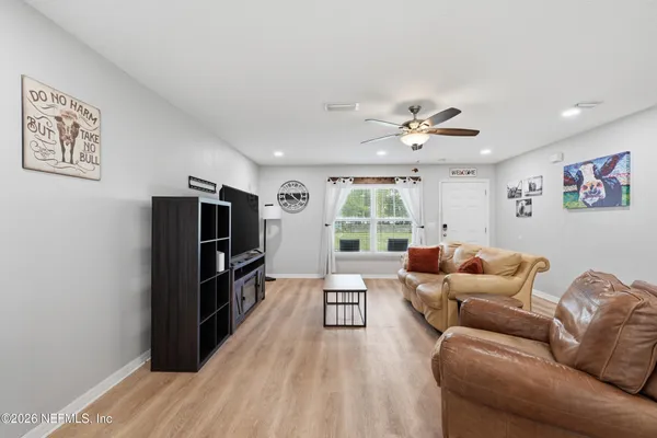 a living room with furniture and a large window