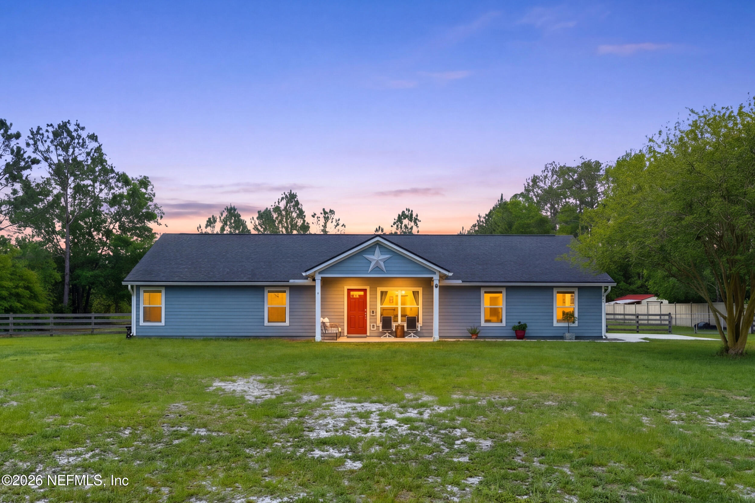 2471 Iris Street Middleburg, FL 32068 - Photo 2 of 40 a front view of a house with a yard