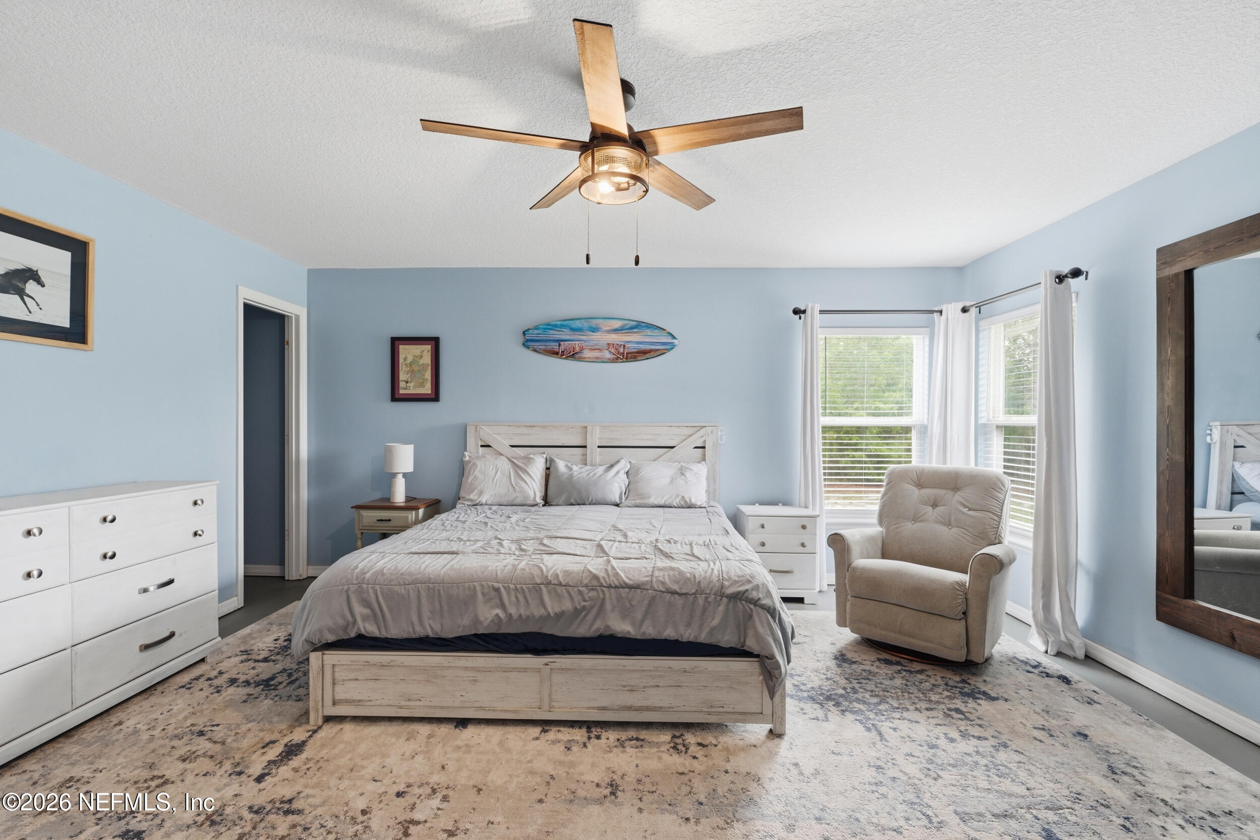 2471 Iris Street Middleburg, FL 32068 - Photo 23 of 40 a bedroom with a bed and a couch