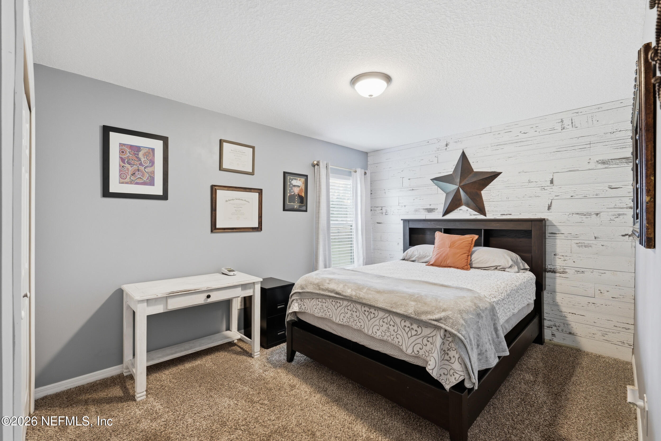 2471 Iris Street Middleburg, FL 32068 - Photo 26 of 40 a bedroom with a bed and a desk
