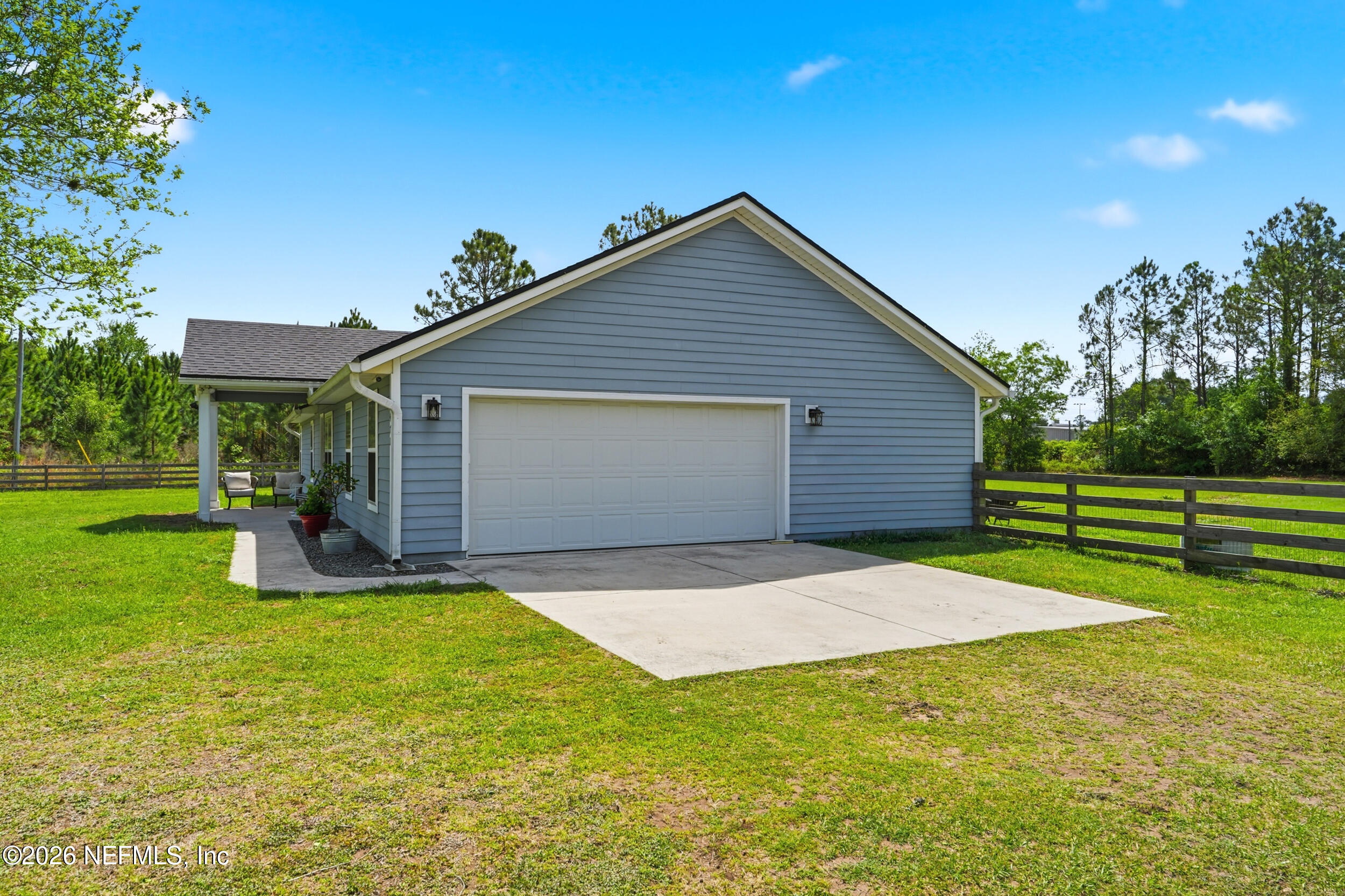 2471 Iris Street Middleburg, FL 32068 - Photo 31 of 40 a view of a house with a yard and tree