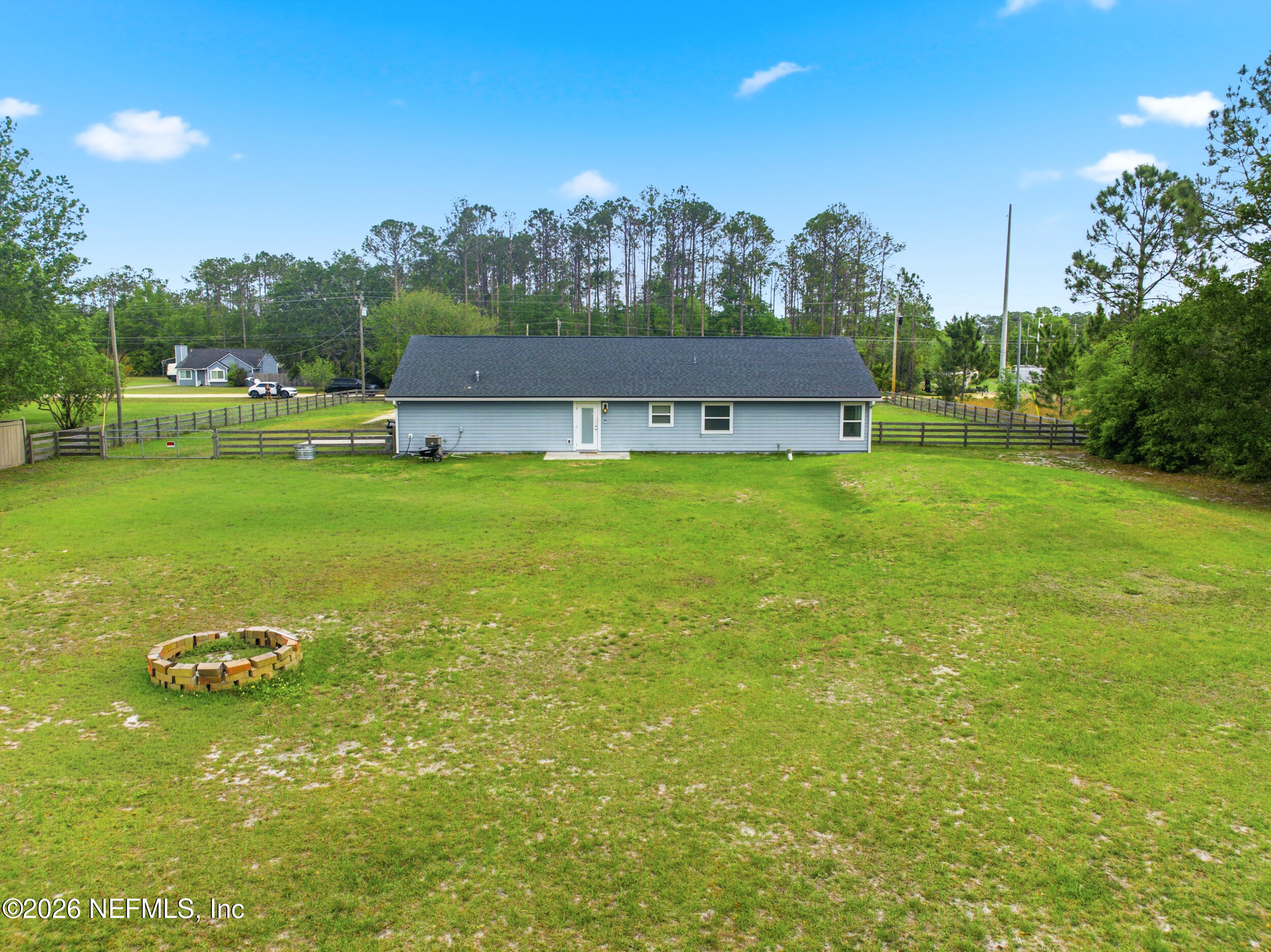 2471 Iris Street Middleburg, FL 32068 - Photo 32 of 40 a view of a big yard with a house