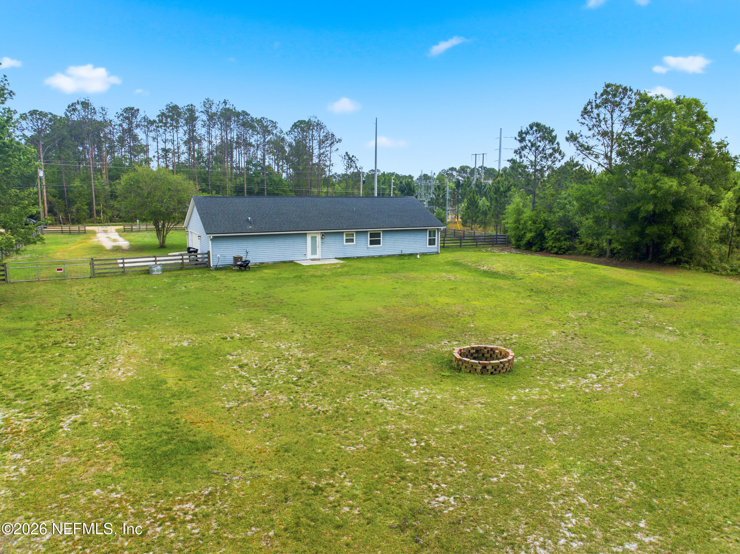 2471 Iris Street Middleburg, FL 32068 - Photo 33 of 40 a view of a big yard with a house