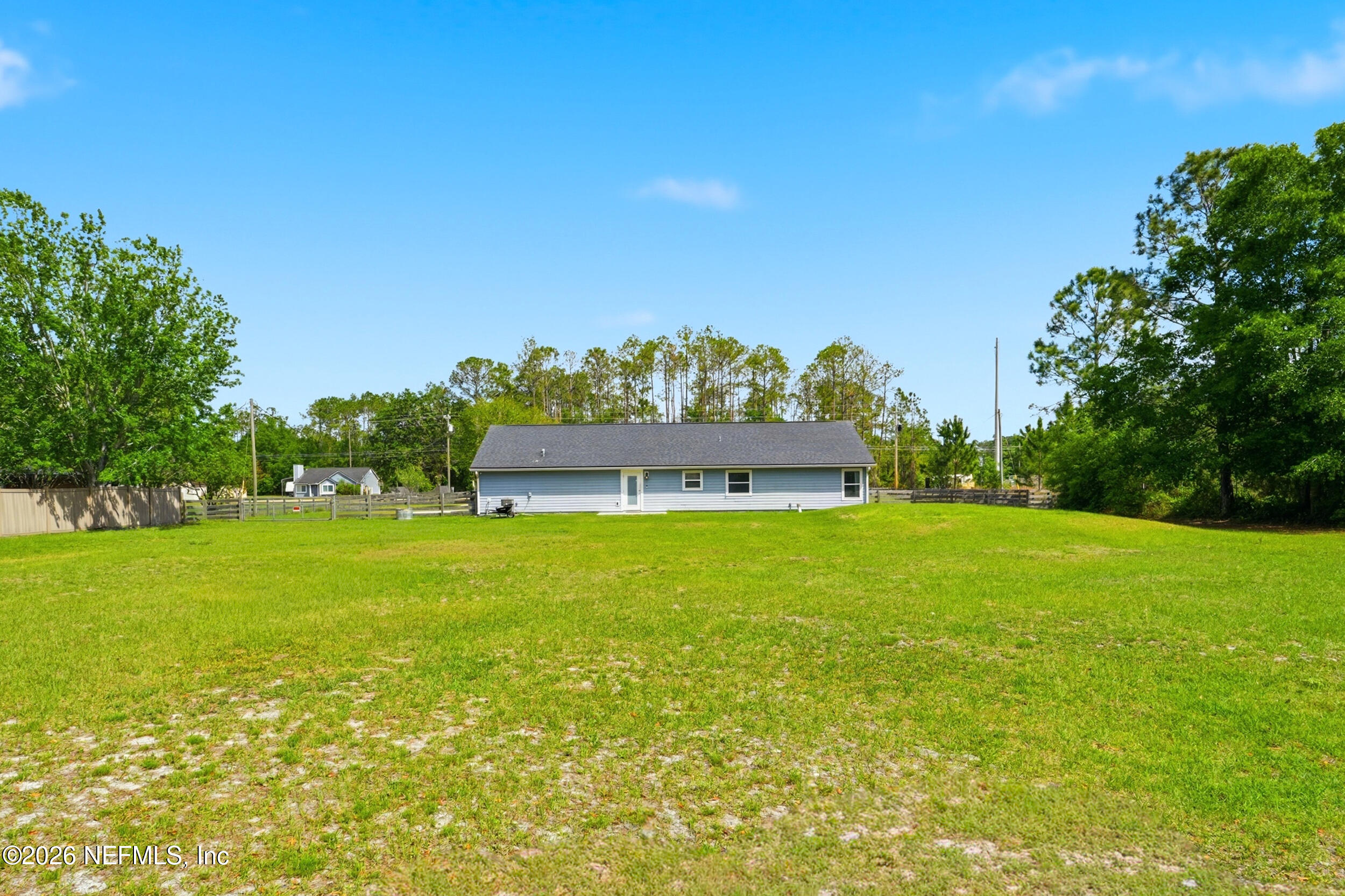 2471 Iris Street Middleburg, FL 32068 - Photo 34 of 40 a view of a big yard with a large tree and a big yard