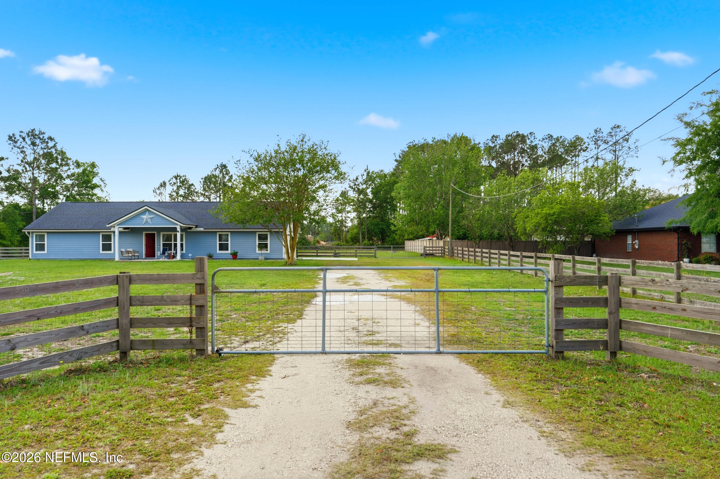 2471 Iris Street Middleburg, FL 32068 - Photo 36 of 40 a front view of a house with a yard