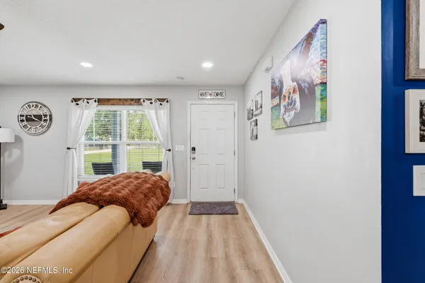 a spacious bedroom with a large bed and a window