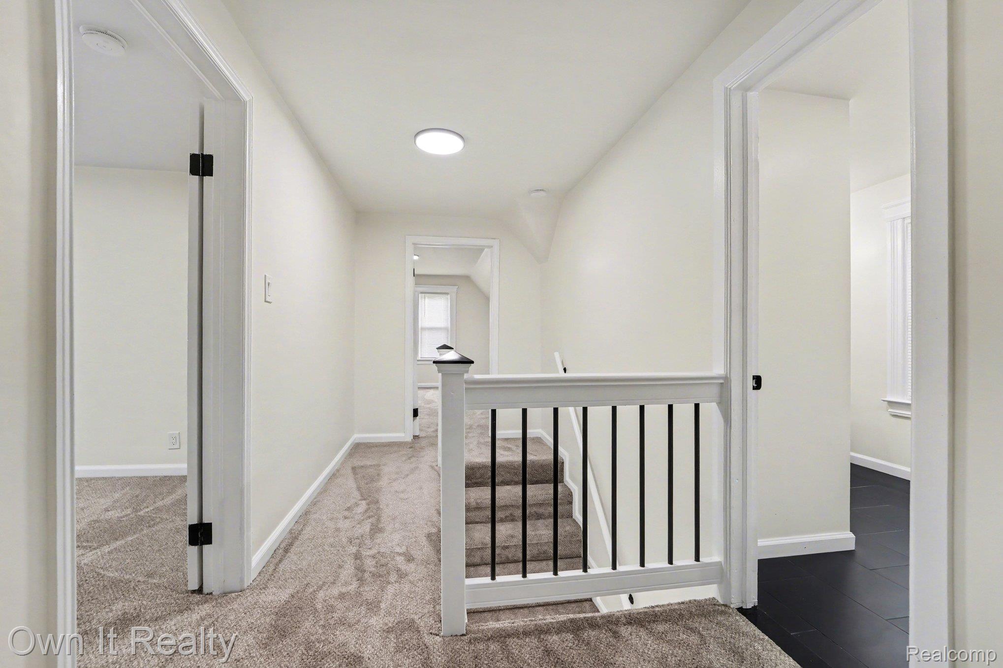 168 Kerby Road Grosse Pointe, MI 48236 - Photo 15 of 36 Corridor featuring an upstairs landing and light colored carpet
