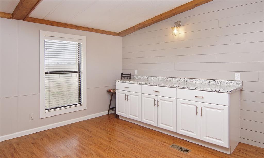 1059 Airport Road Graford, TX 76449 - Photo 15 of 37 Dining Space with Dry Bar and Cabinetry