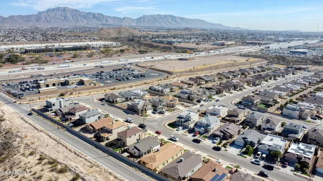 a spacious bedroom with a bed and a large window