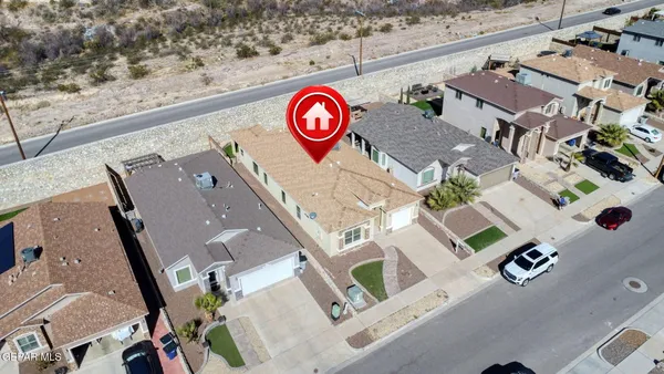 an aerial view of residential house with outdoor space
