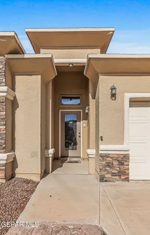 a kitchen with stainless steel appliances granite countertop a refrigerator a stove and a sink