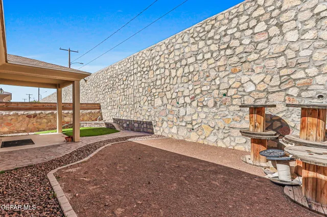 a kitchen with stainless steel appliances granite countertop a stove a microwave and a sink