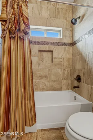 a kitchen with stainless steel appliances granite countertop a refrigerator a stove and a sink