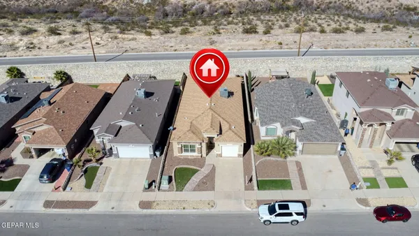 an aerial view of residential houses and outdoor space