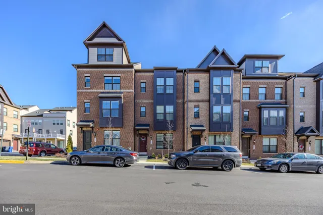 a view of a street that has couple of cars parked on the road