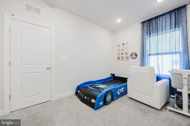 a front view of a house with a yard and a garage