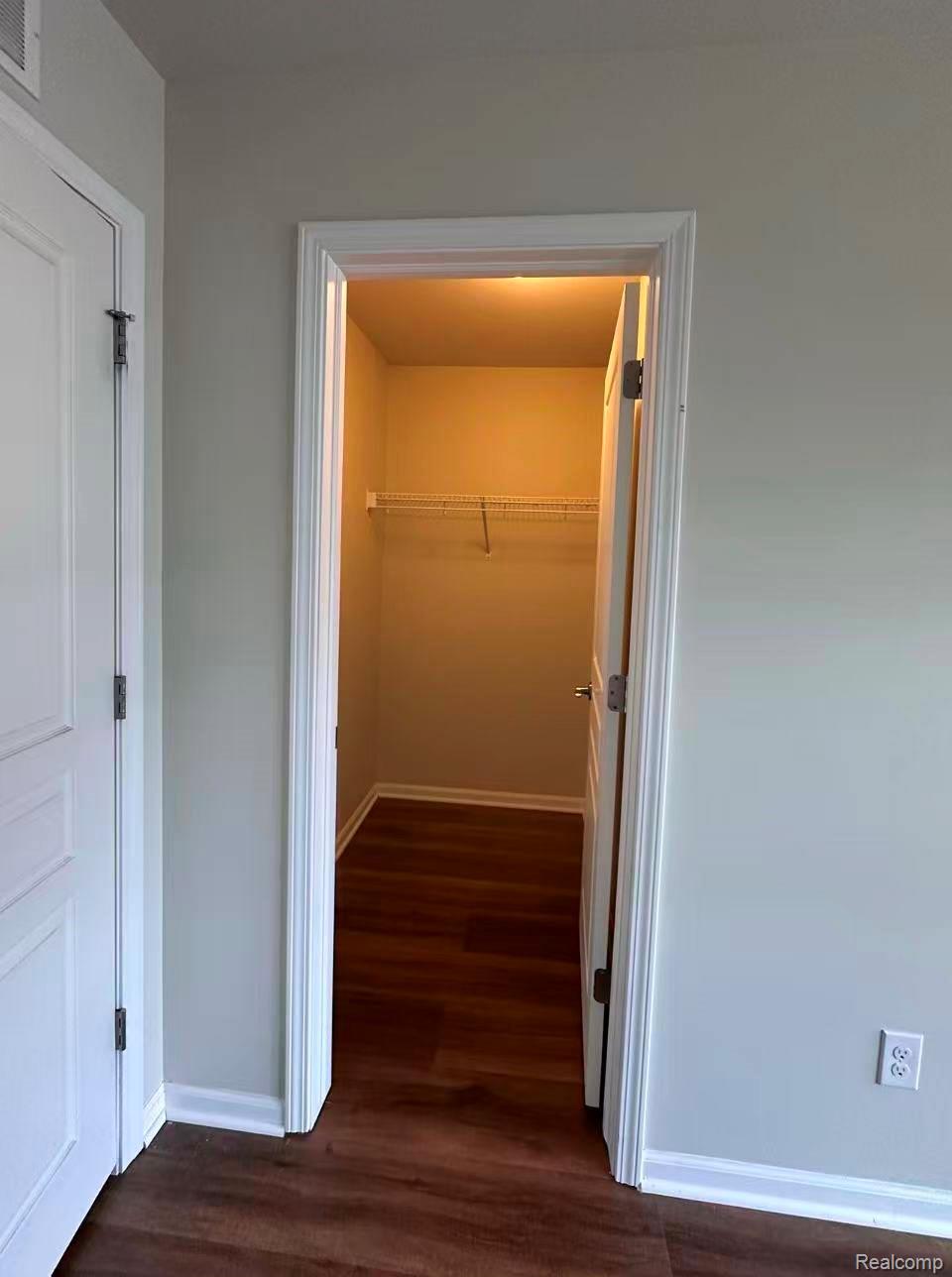 2578 Helmsdale Circle Rochester, MI 48307 - Photo 20 of 33 Closet with wood-finish flooring, white wire shelving, and overhead lighting