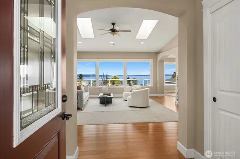 a large white kitchen with a large window