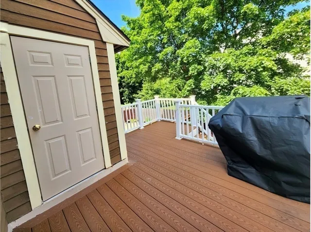 a balcony with wooden floor