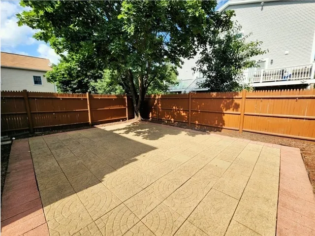 a view of backyard with large trees