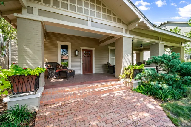 a view of a house with chairs and plants