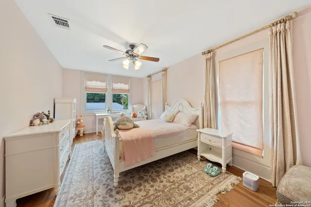 a bed room with a bed and a chandelier