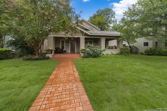 a front view of a house with yard
