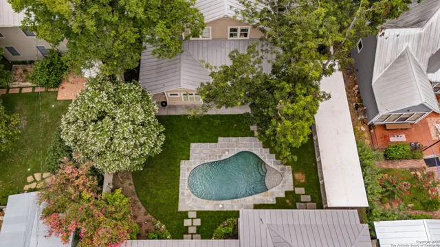 an aerial view of a house having yard