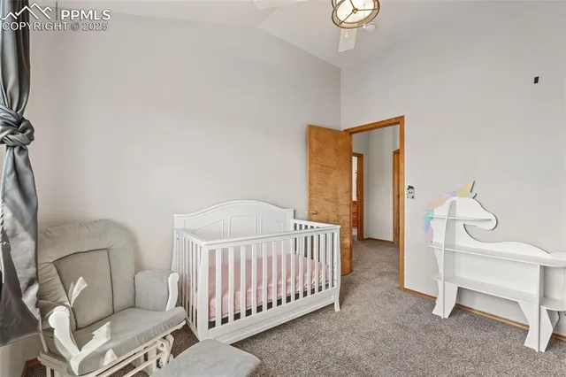 a bedroom with a bed and a chair