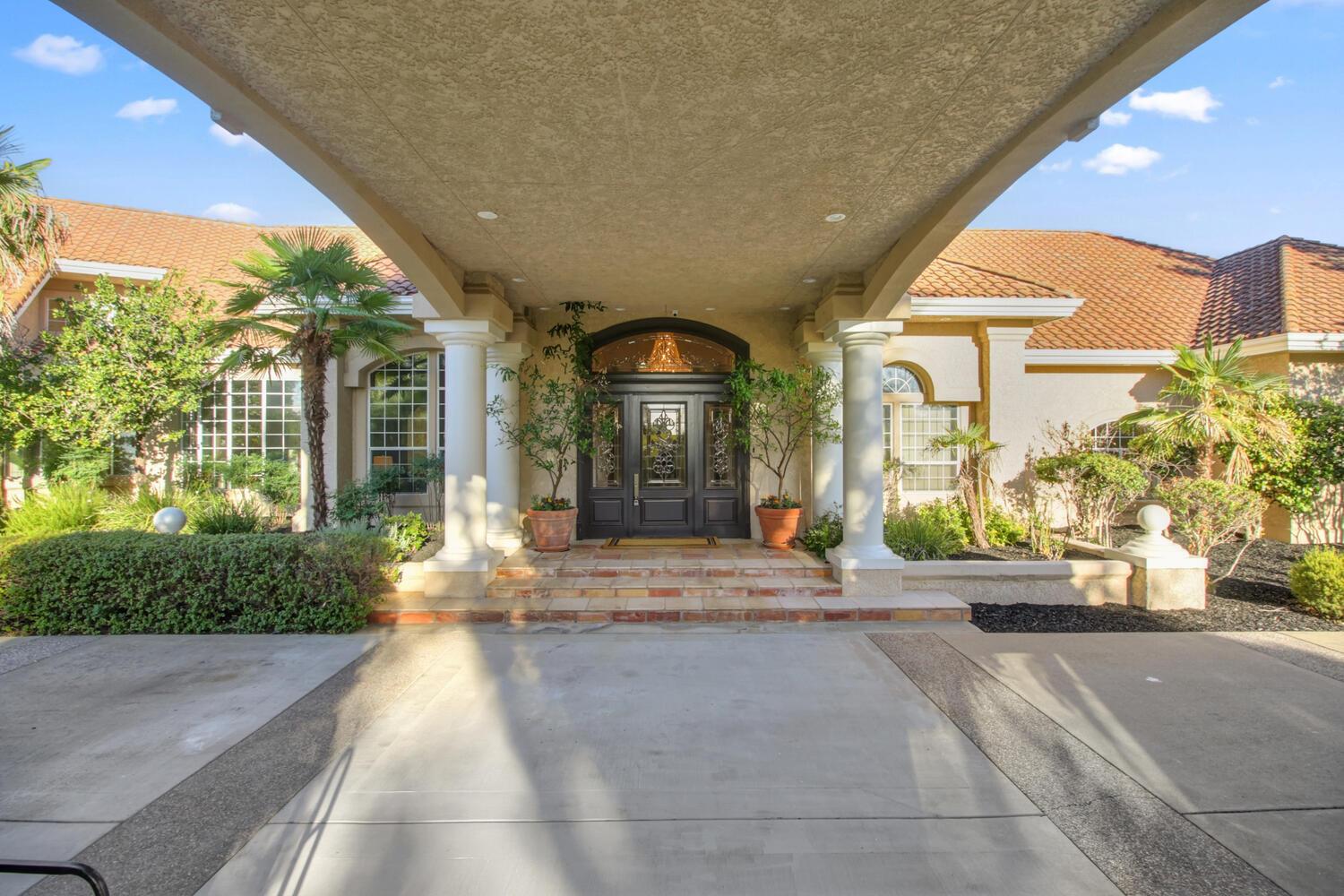 5001 Auburn Folsom Road Loomis, CA 95650 - Photo 5 of 99 a view of a building with entrance gate