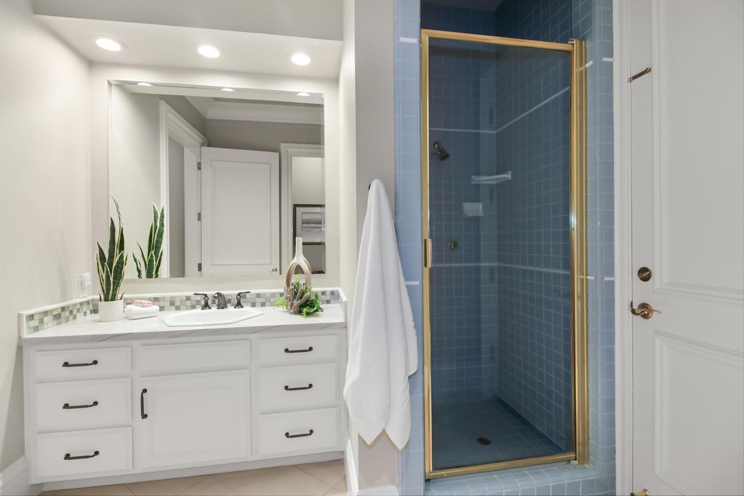 5001 Auburn Folsom Road Loomis, CA 95650 - Photo 61 of 99 a bathroom with a shower sink and mirror