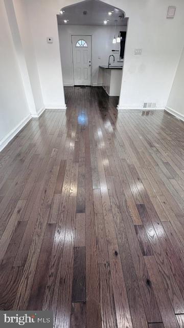 Spacious entryway with gleaming floors.
