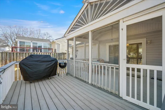 a view of a house with a wooden deck