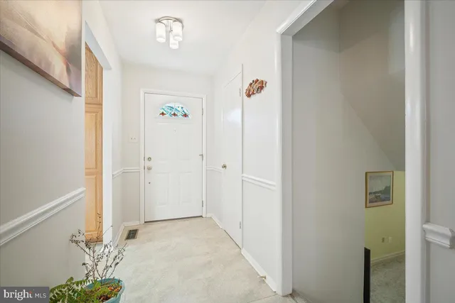 a view of a hallway with wooden shelves
