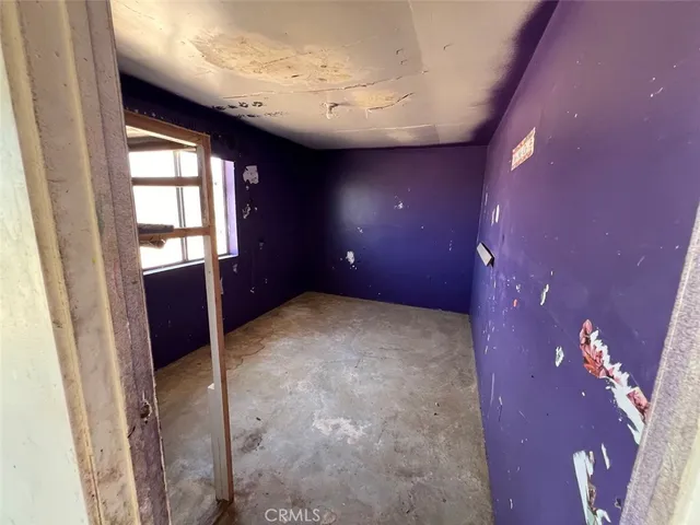 a view of a hallway with a white walls