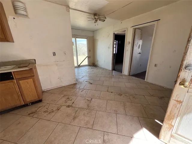 a kitchen with stainless steel appliances a stove a sink and a refrigerator