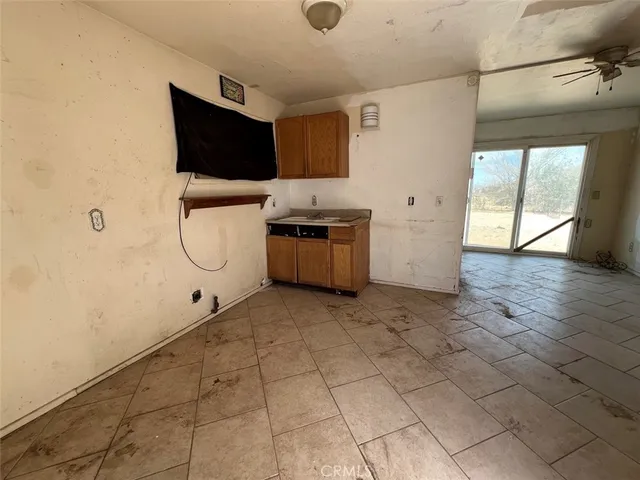 a view of a kitchen from the hallway